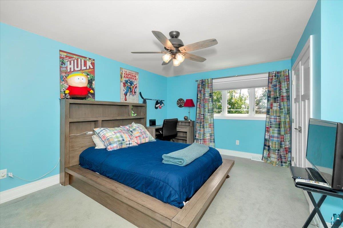 1323 South Ridge Road Duluth, MN 55804 - Photo 17 of 31 Bedroom featuring carpet and ceiling fan
