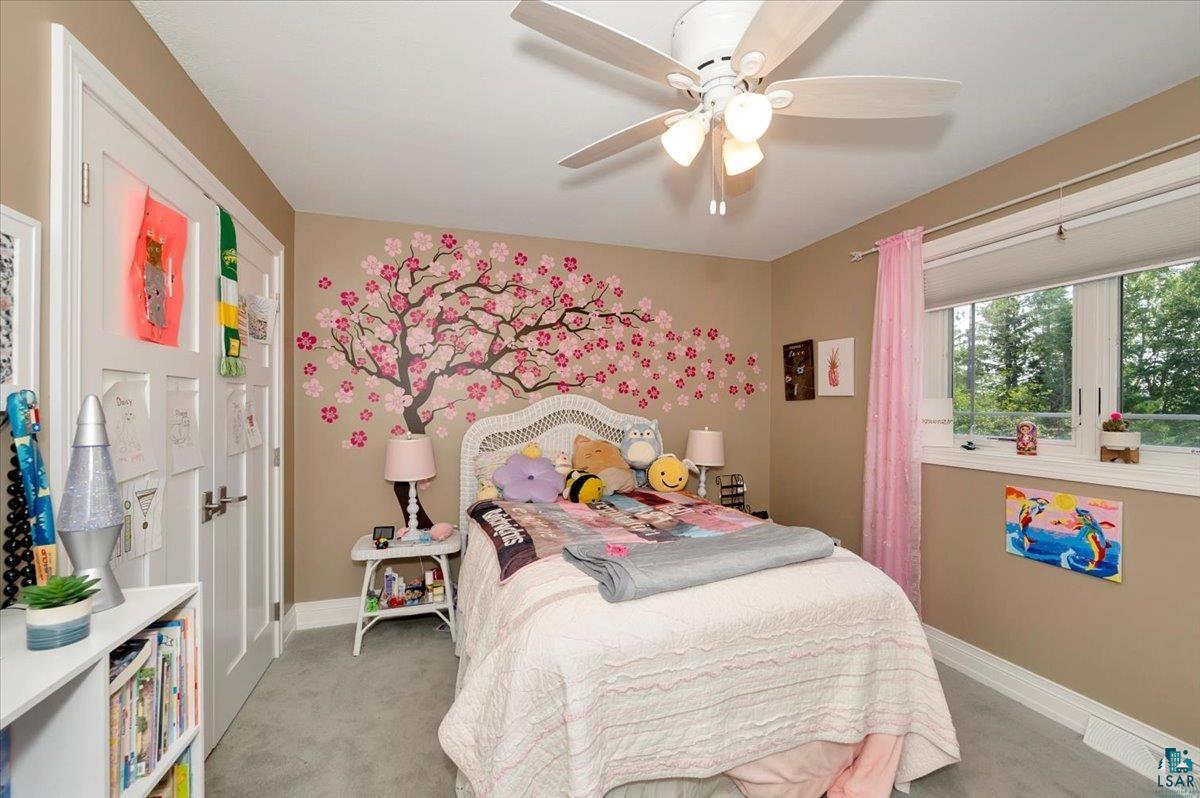 1323 South Ridge Road Duluth, MN 55804 - Photo 19 of 31 Bedroom with light carpet and ceiling fan