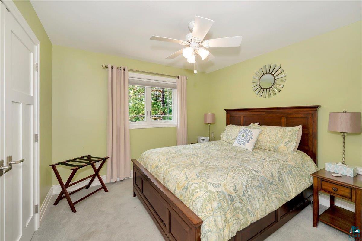 1323 South Ridge Road Duluth, MN 55804 - Photo 20 of 31 Bedroom with light carpet and ceiling fan