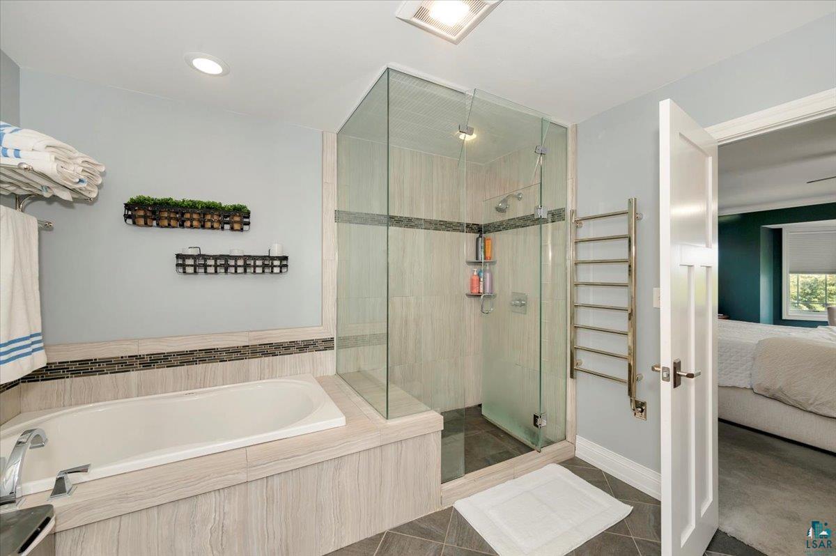 1323 South Ridge Road Duluth, MN 55804 - Photo 21 of 31 Bathroom with shower with separate bathtub and tile patterned flooring