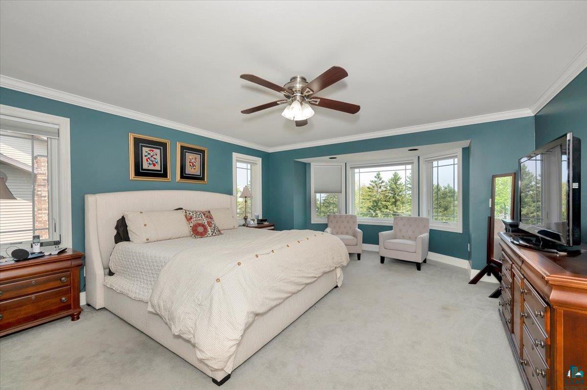 1323 South Ridge Road Duluth, MN 55804 - Photo 24 of 31 Carpeted bedroom with crown molding and ceiling fan