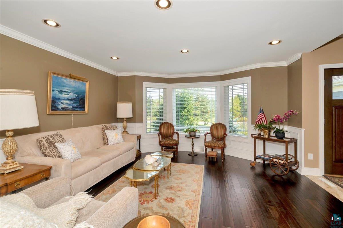 1323 South Ridge Road Duluth, MN 55804 - Photo 26 of 31 Living room featuring wood-type flooring, crown molding, and a wealth of natural light