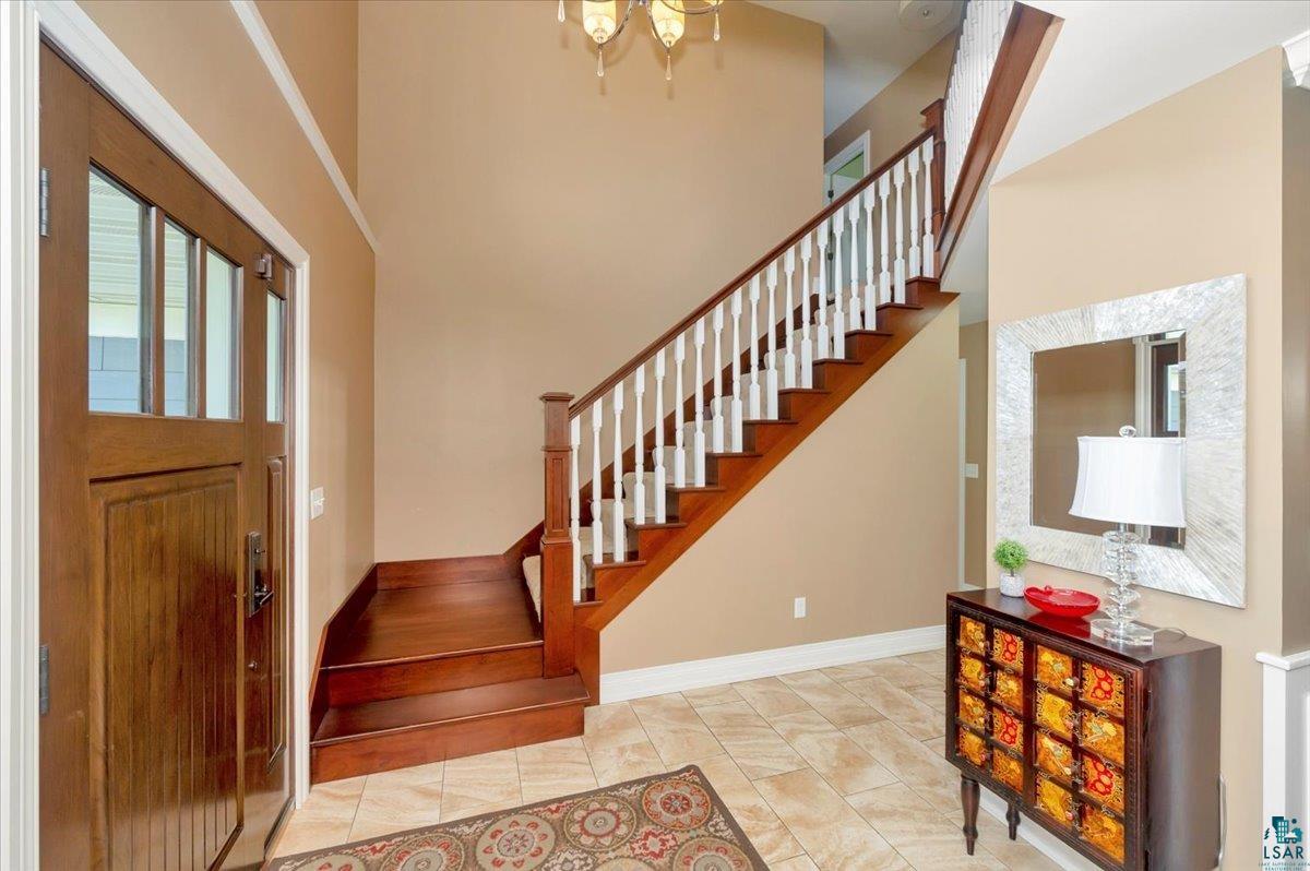 1323 South Ridge Road Duluth, MN 55804 - Photo 5 of 31 Foyer entrance with a towering ceiling and light tile patterned floors