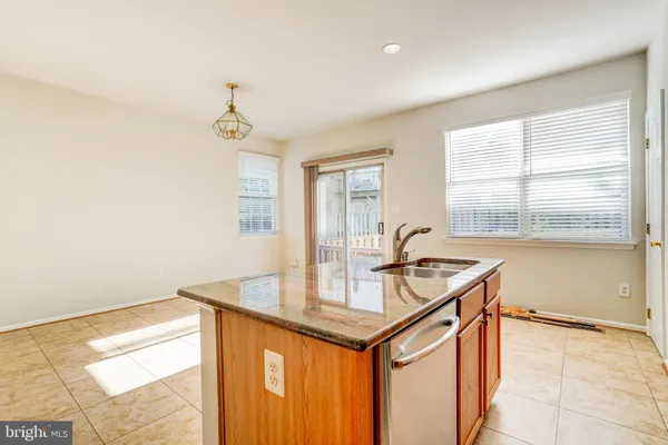 a kitchen with a sink cabinets and window