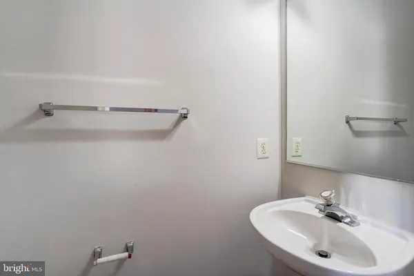 a bathroom with a sink and mirror