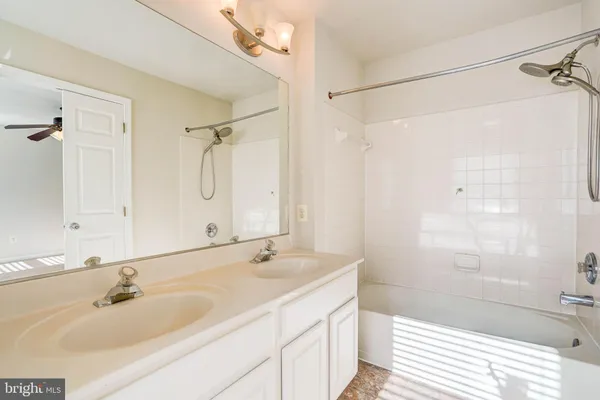 a bathroom with a sink double vanity and shower