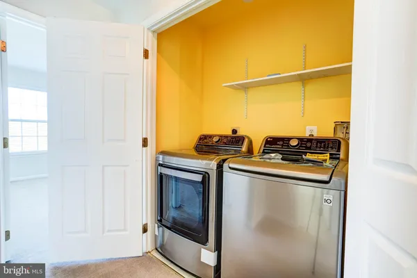 a kitchen with stainless steel appliances granite countertop a stove and a refrigerator