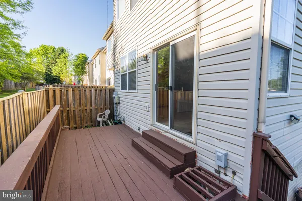 a view of a wooden chairs on the deck