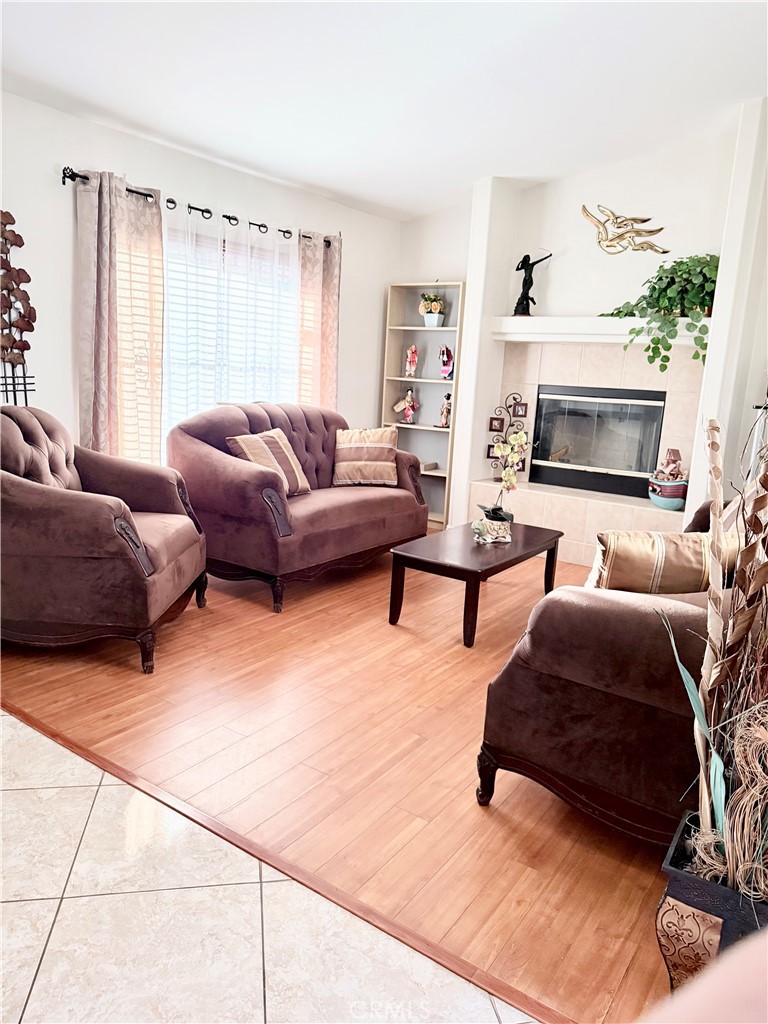 916 Roxanne Drive Hemet, CA 92543 - Photo 4 of 32 a living room with furniture and a fireplace
