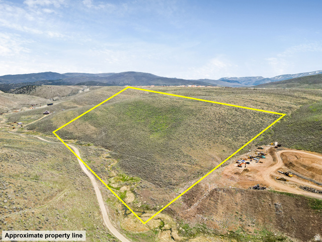 55 Browns Canyon Road, Unit 55 Peoa, UT 84061 - Photo 8 of 17 Aerial view of sparsely populated area featuring property boundaries highlighted and a mountain backdrop
