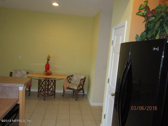 706 Crystal Way Orange Park, FL 32065 - Photo 11 of 31 a view of a room with furniture and a potted plant