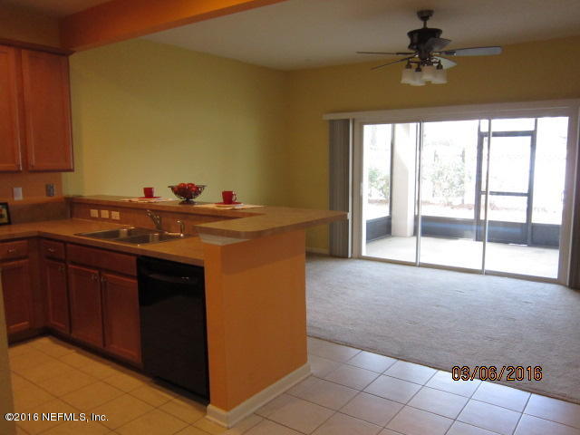 706 Crystal Way Orange Park, FL 32065 - Photo 13 of 31 a kitchen that has a sink and a stove