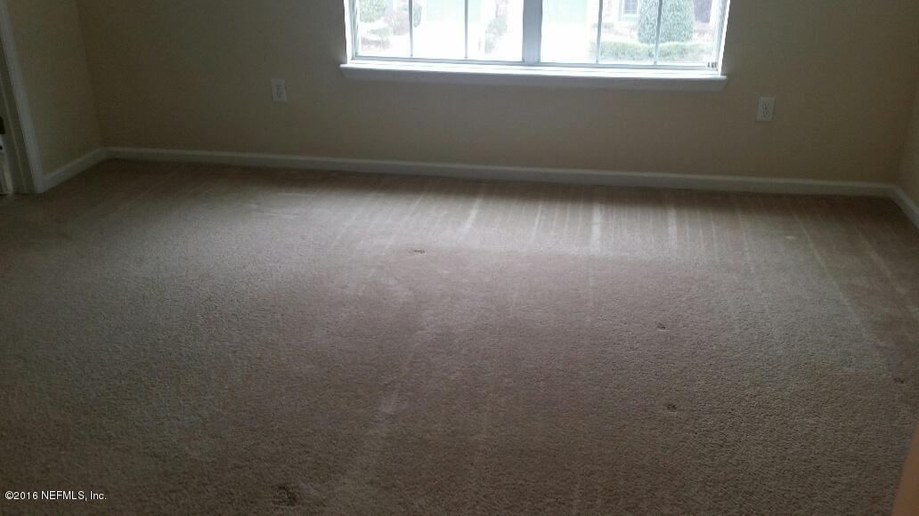 706 Crystal Way Orange Park, FL 32065 - Photo 15 of 31 an empty room with a window