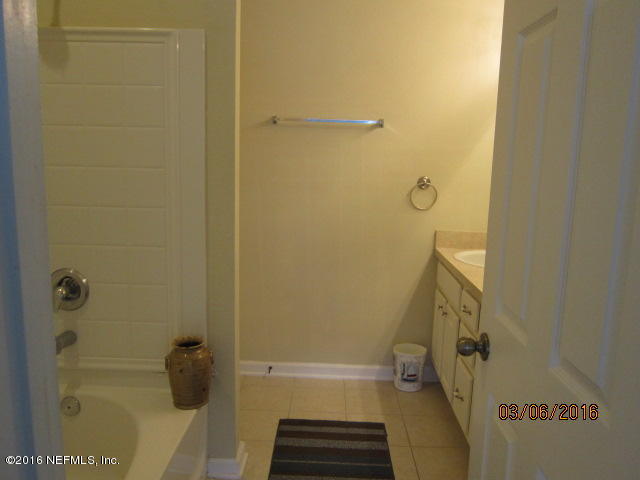 706 Crystal Way Orange Park, FL 32065 - Photo 16 of 31 a bathroom with a shower