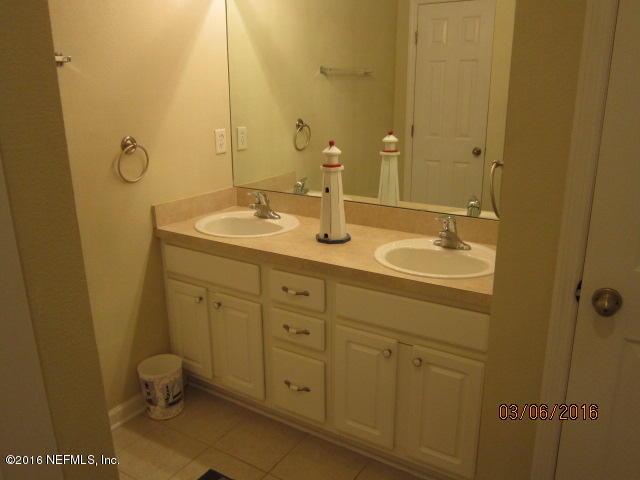 706 Crystal Way Orange Park, FL 32065 - Photo 17 of 31 a bathroom with a granite countertop sink toilet and shower