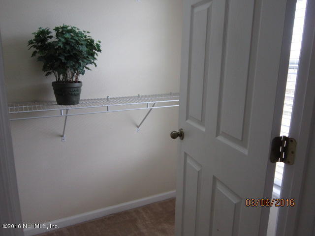 706 Crystal Way Orange Park, FL 32065 - Photo 19 of 31 a vase of flowers sitting on a shelf