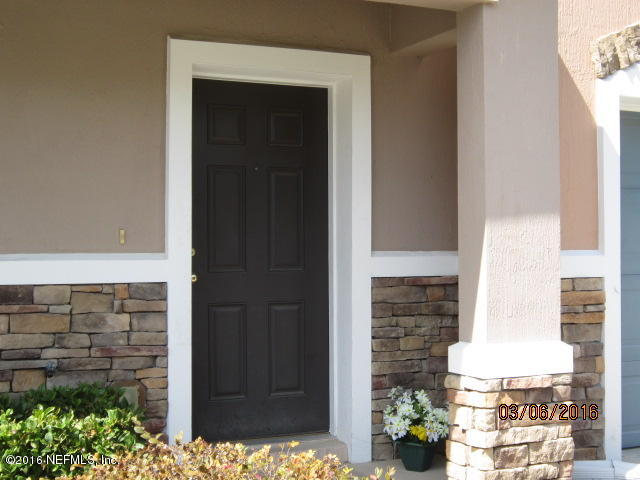706 Crystal Way Orange Park, FL 32065 - Photo 2 of 31 a front view of a house with a garage