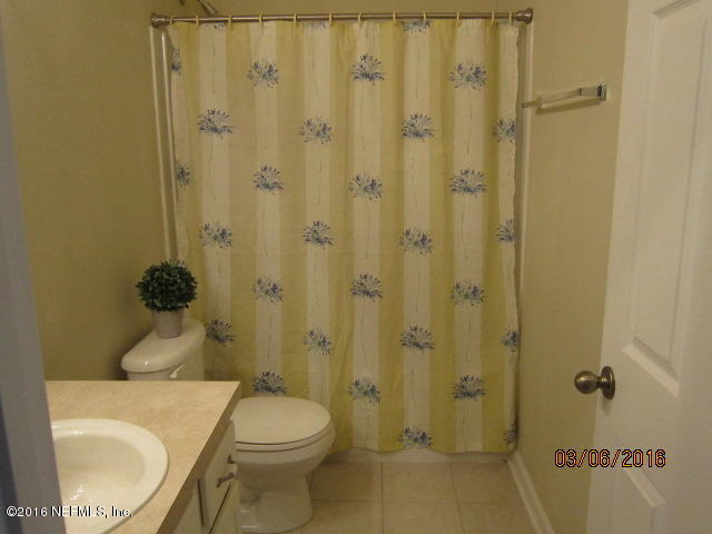 706 Crystal Way Orange Park, FL 32065 - Photo 21 of 31 a bathroom with a toilet a sink and shower