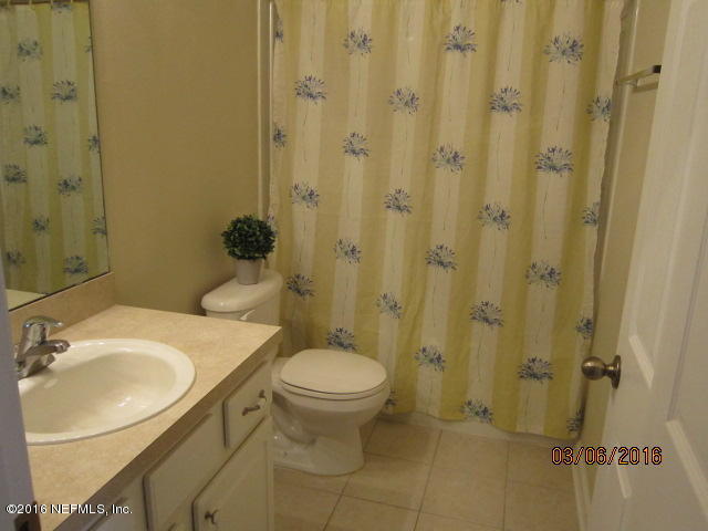 706 Crystal Way Orange Park, FL 32065 - Photo 22 of 31 a bathroom with a sink toilet and shower