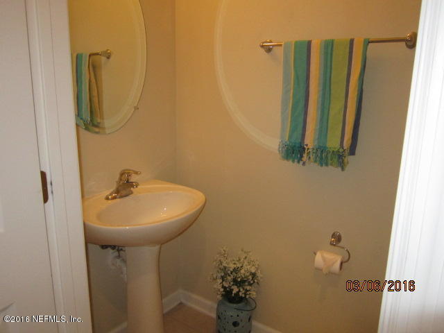 706 Crystal Way Orange Park, FL 32065 - Photo 24 of 31 a bathroom with a sink a mirror and toilet