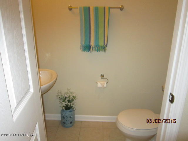 706 Crystal Way Orange Park, FL 32065 - Photo 25 of 31 a bathroom with a toilet and a shower