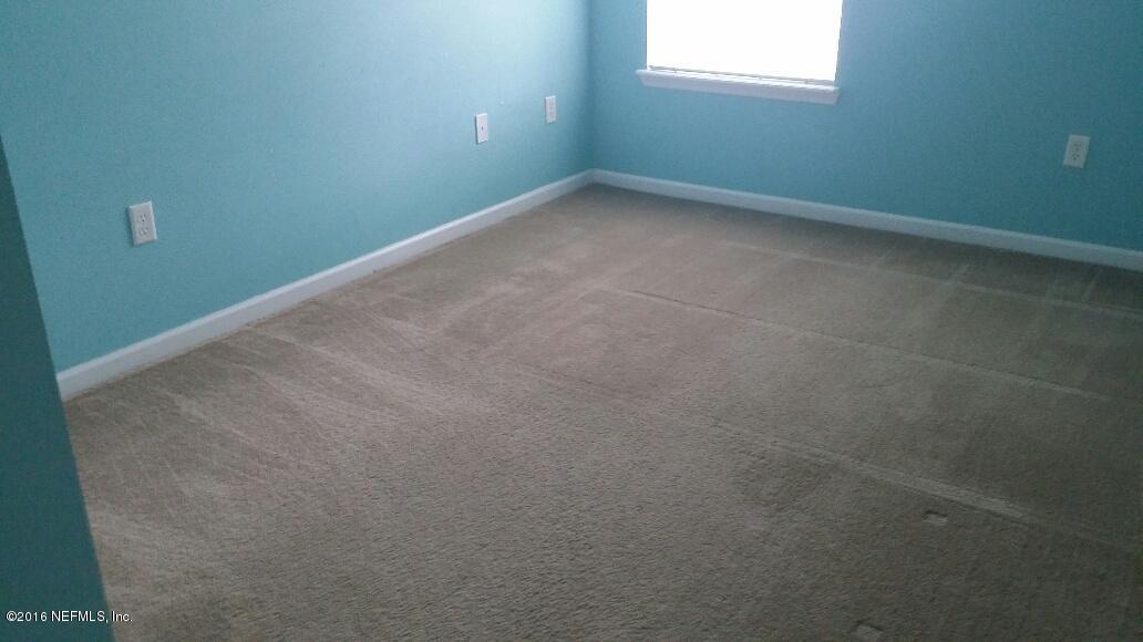 706 Crystal Way Orange Park, FL 32065 - Photo 27 of 31 an empty room with a window