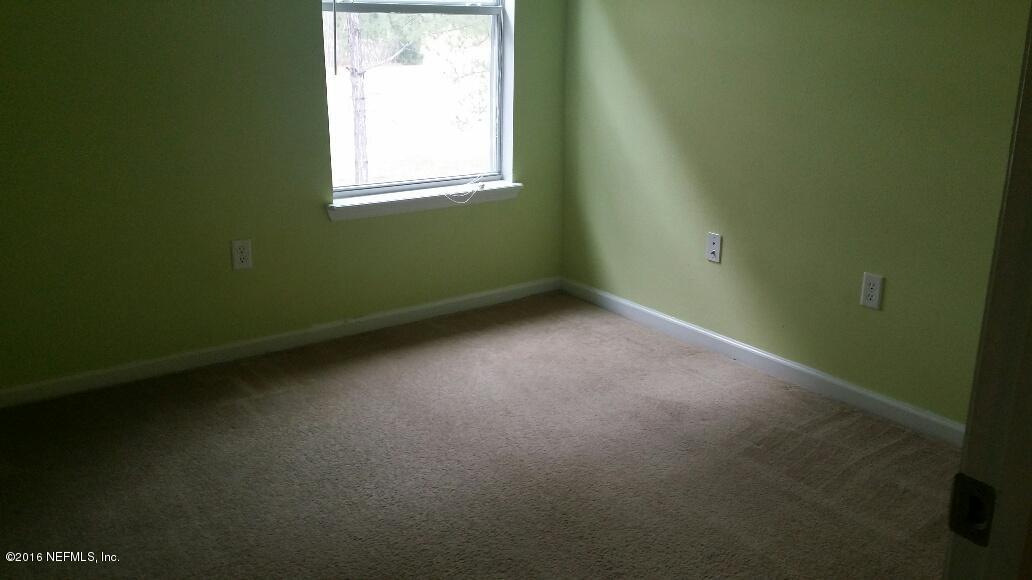 706 Crystal Way Orange Park, FL 32065 - Photo 29 of 31 a view of an empty room with a window