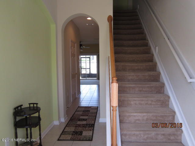 706 Crystal Way Orange Park, FL 32065 - Photo 3 of 31 a view of a hallway with wooden floor and entryway