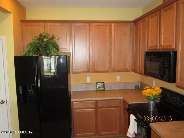 706 Crystal Way Orange Park, FL 32065 - Photo 5 of 31 a kitchen with a sink and cabinets