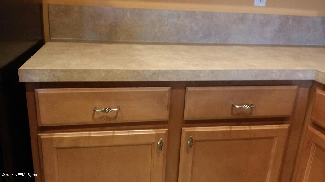 706 Crystal Way Orange Park, FL 32065 - Photo 8 of 31 a close up view of washer and dryer