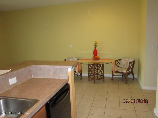 706 Crystal Way Orange Park, FL 32065 - Photo 10 of 31 a terrace with a table and chairs