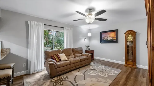 a living room with furniture and a window