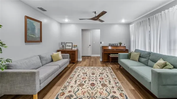 a living room with furniture and a rug