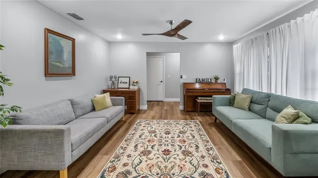 a living room with furniture and a rug