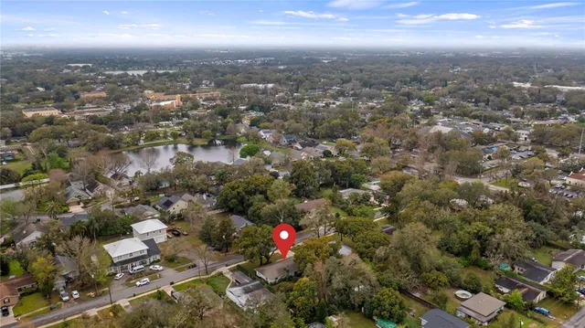 an aerial view of residential houses with city and lake view