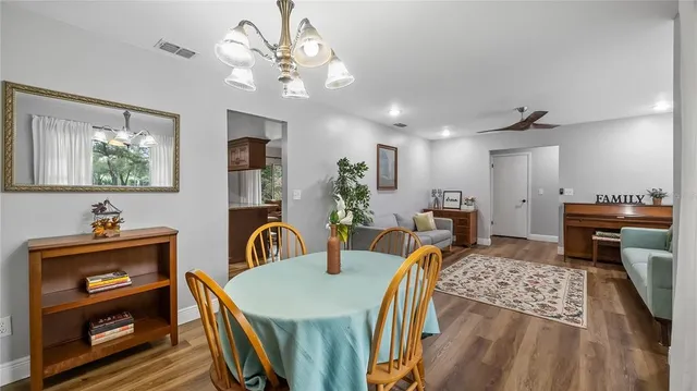 a bedroom with furniture and a chandelier