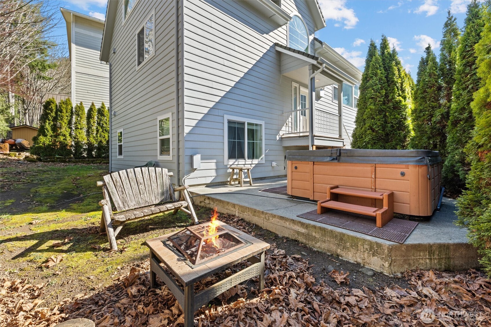 481 Maple Grove Road Port Angeles, WA 98363 - Photo 31 of 40 a view of a lounge chair in the backyard of a house
