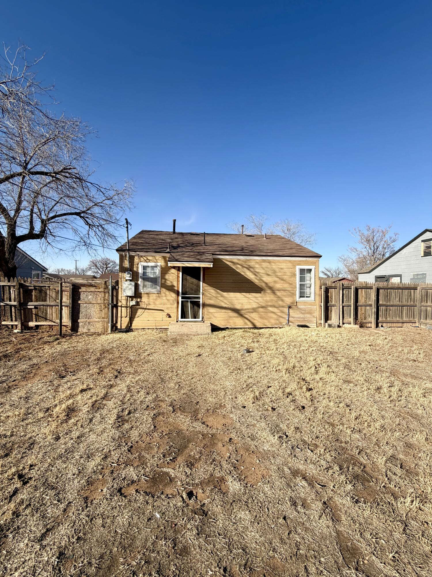 2605 1st Street Lubbock, TX 79415 - Photo 11 of 12 a front view of a house with a yard