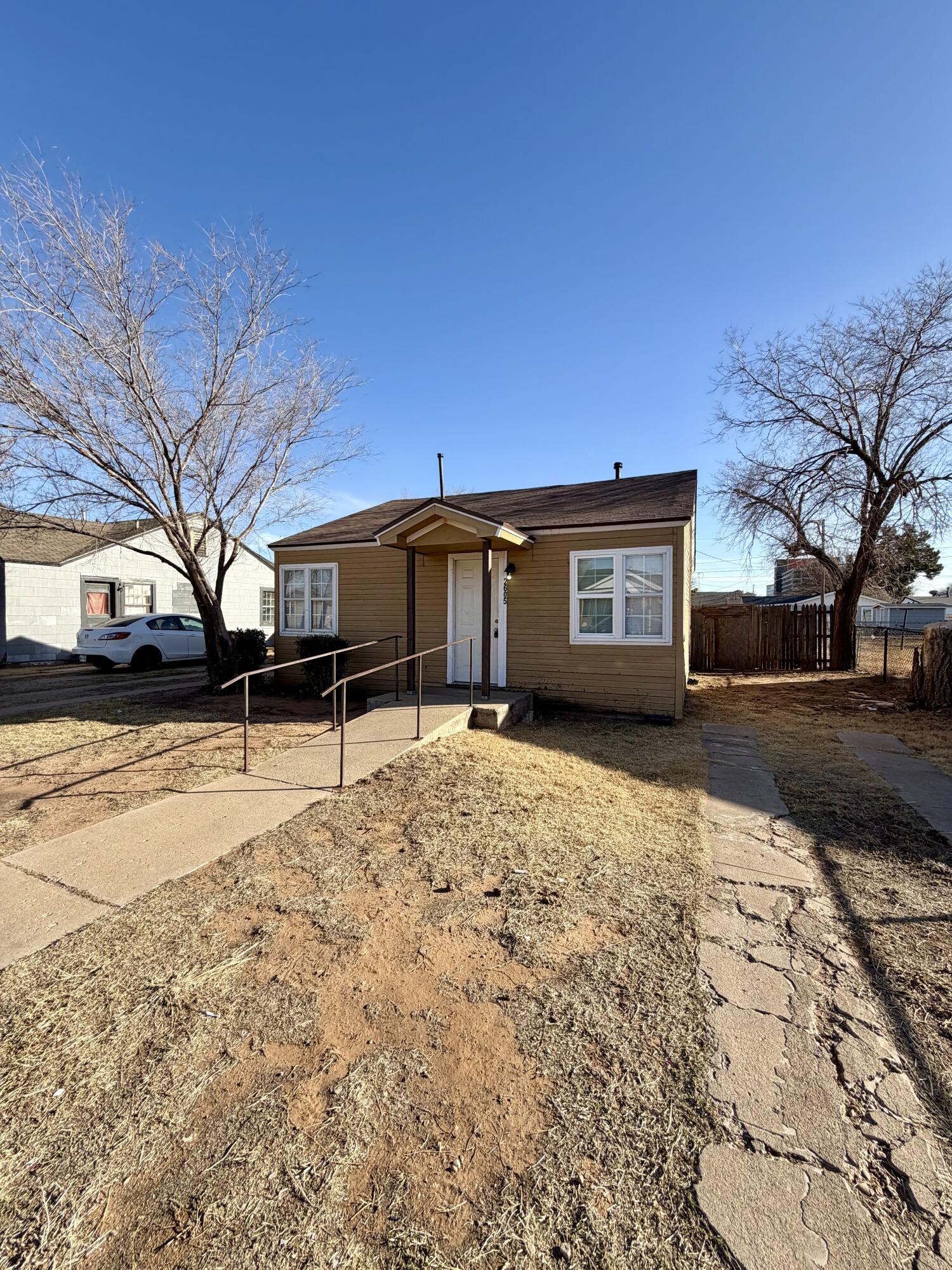 2605 1st Street Lubbock, TX 79415 - Photo 2 of 12 a front view of a house with a yard