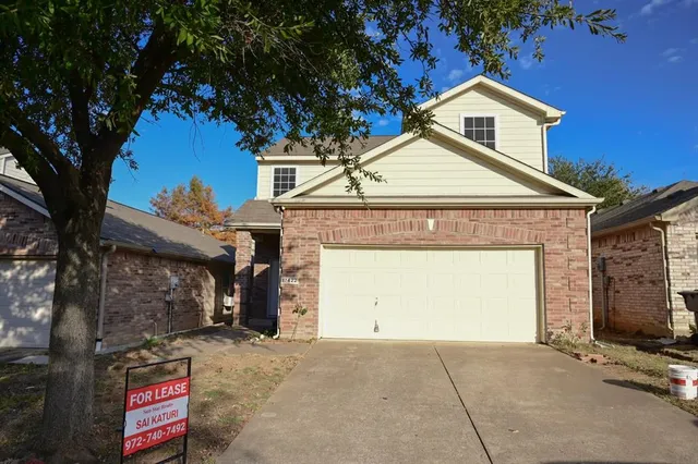 a front view of a house with a garage