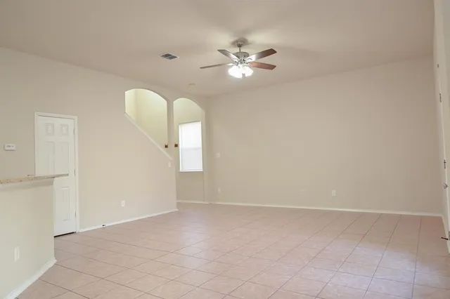 a view of a livingroom with a chandelier fan