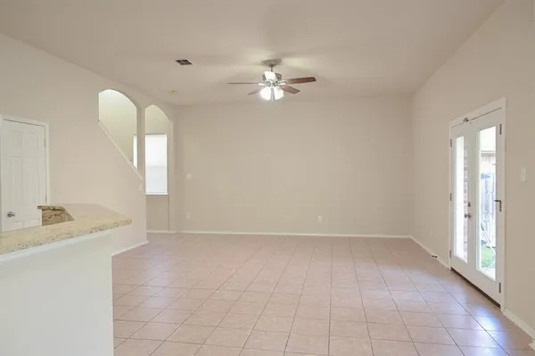wooden floor in an empty room with a mirror