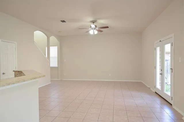 wooden floor in an empty room with a mirror