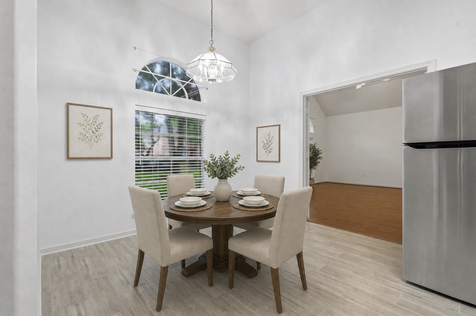 5815 Pheasant Ridge Lane Houston, TX 77041 - Photo 13 of 43 Enjoy the casual dining area, the perfect place to start your day with a cup of coffee or tea while taking in the beautiful views of the lush front yard landscaping. Filled with natural light, this inviting space offers a warm and relaxing atmosphere for everyday meals, morning conversations, or simply enjoying a peaceful moment. This home has been virtually staged to showcase its potential.