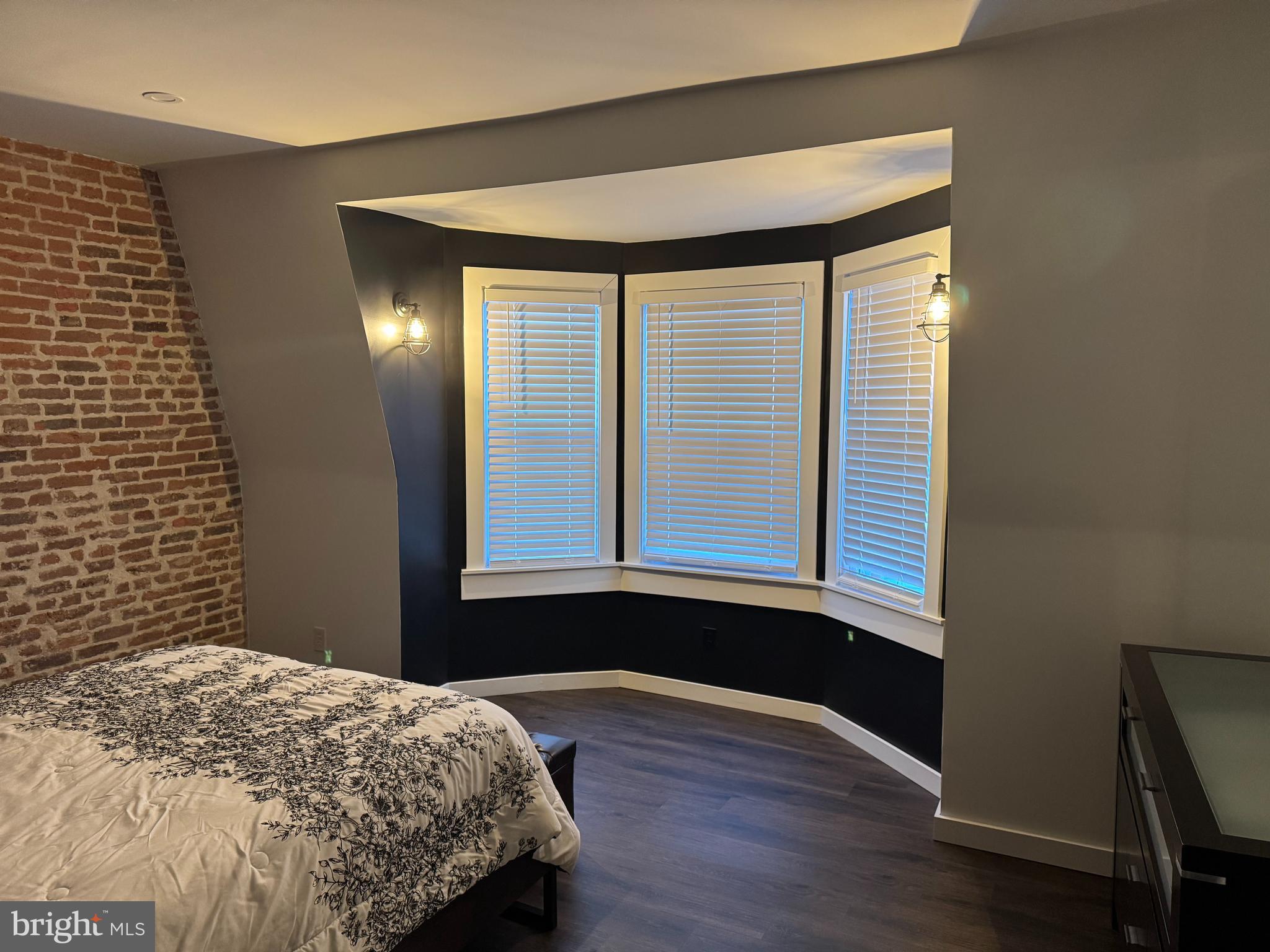 814 Chestnut Street Reading, PA 19602 - Photo 8 of 13 a bedroom with a bed and a window