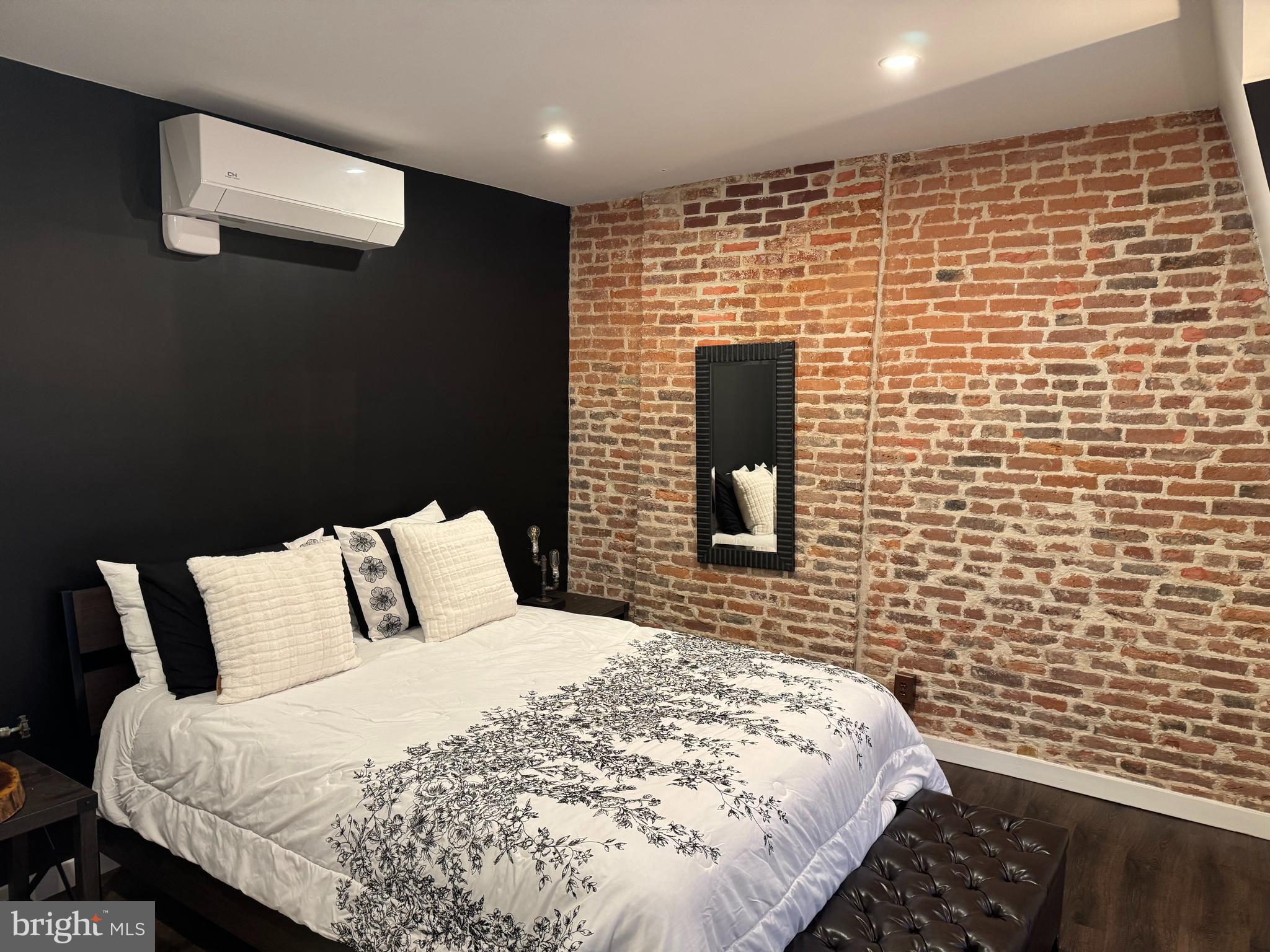 814 Chestnut Street Reading, PA 19602 - Photo 10 of 13 a bedroom with a bed and a black wall