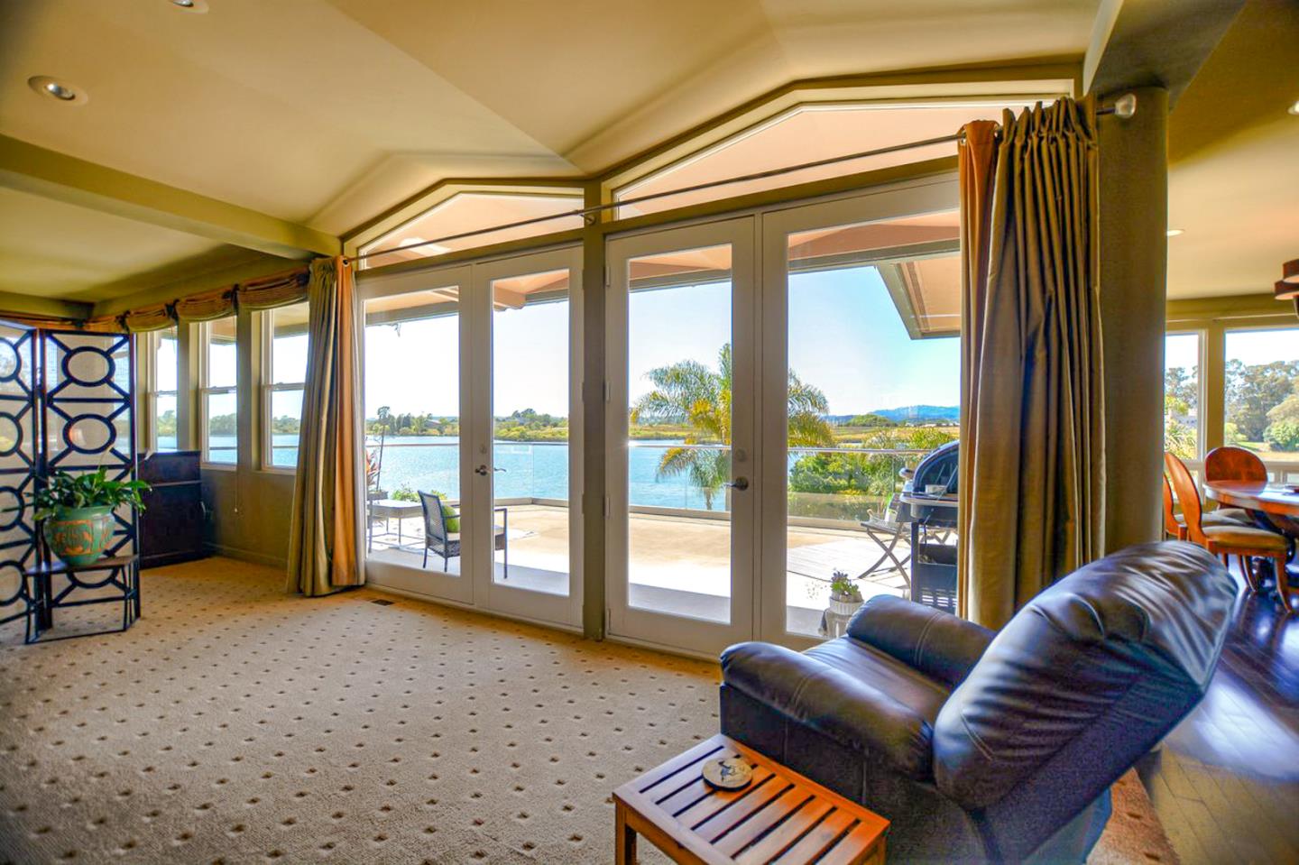 149 Cutter Drive Watsonville, CA 95076 - Photo 16 of 49 a living room with furniture and a floor to ceiling window