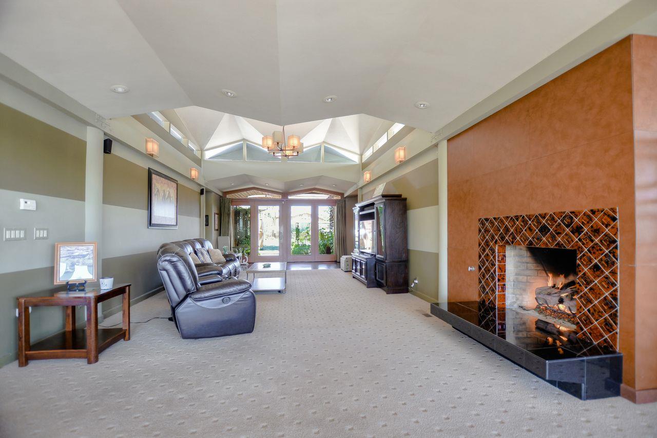 149 Cutter Drive Watsonville, CA 95076 - Photo 19 of 49 a living room with furniture a fireplace and a large window