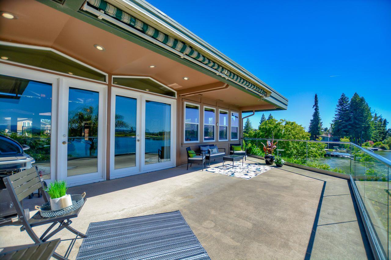 149 Cutter Drive Watsonville, CA 95076 - Photo 27 of 49 a patio with table and chairs and potted plants