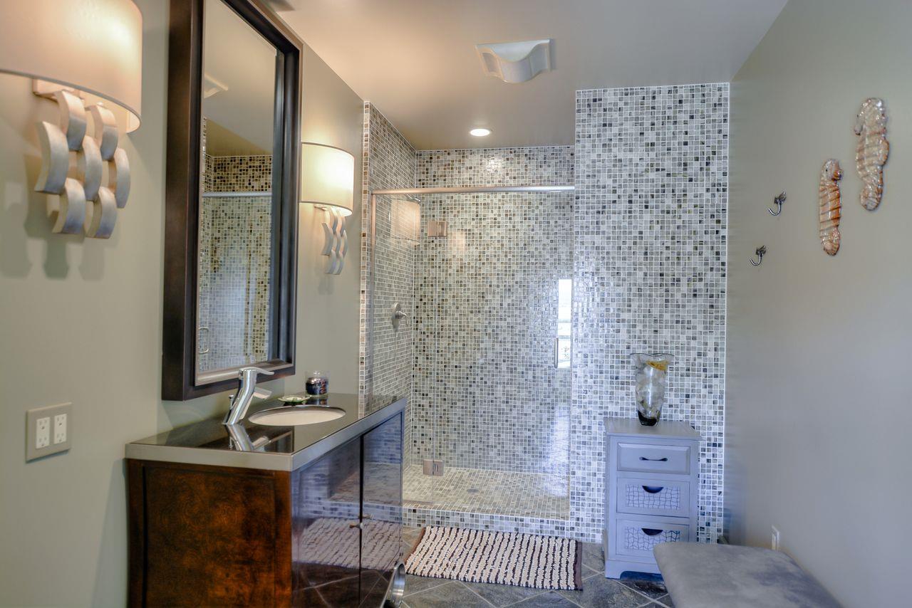 149 Cutter Drive Watsonville, CA 95076 - Photo 45 of 49 a bathroom with a sink a mirror and a shower